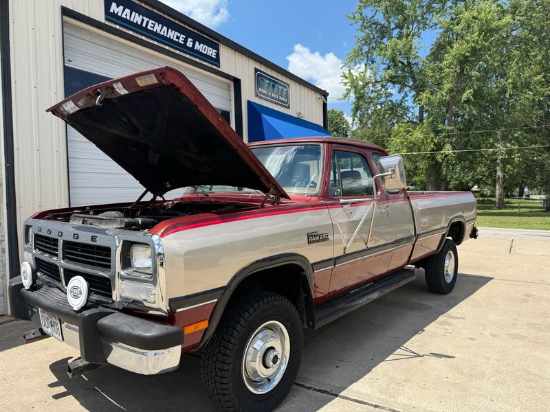 First-generation Dodge pickup with the hood up outside Elite Diesel & Auto Works