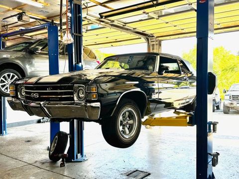 Classic American car raised on a lift