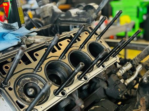 Cylinder head with head bolts during a diesel engine repair