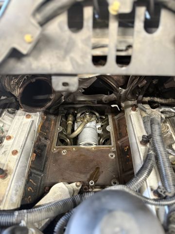 Top of an engine with the intake removed, showing the pump and gears in the engine valley