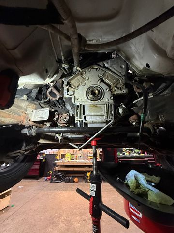 View from under a lift of the back of an engine with the transmission removed