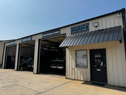 Front of the Elite Diesel & Auto Works shop in Oak Grove with three open service bays