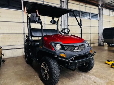 Red utility side-by-side in a service bay