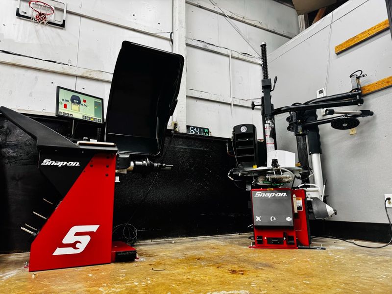 Snap-on tire changer and wheel balancer in the Elite Diesel & Auto Works tire area
